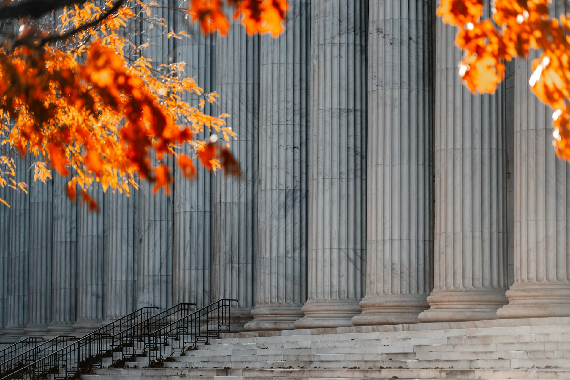 The outside of a courthouse in autumn.